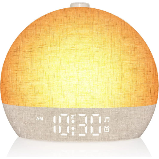 Easylight sunrise alarm clock on a nightstand, glowing warm before the alarm